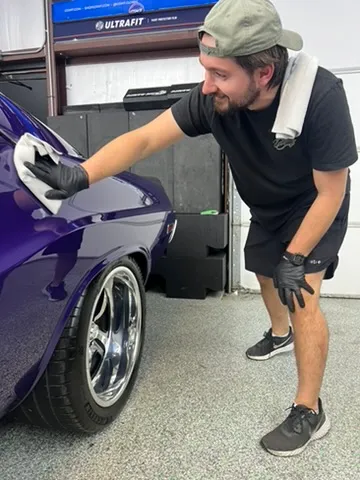 Paint correction on a purple coupe